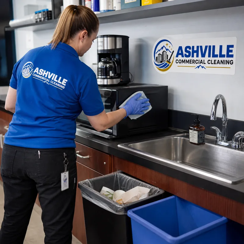 Commercial breakroom counter and sink being cleaned while appliances and the trash area are tidied